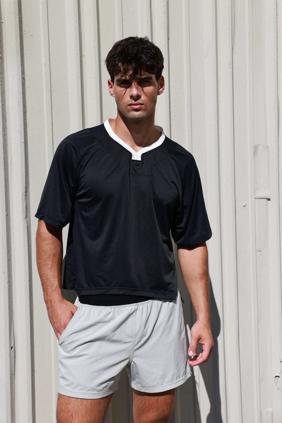 PODIO Midnight Boxy Semi-Cropped Training Tee on model, front