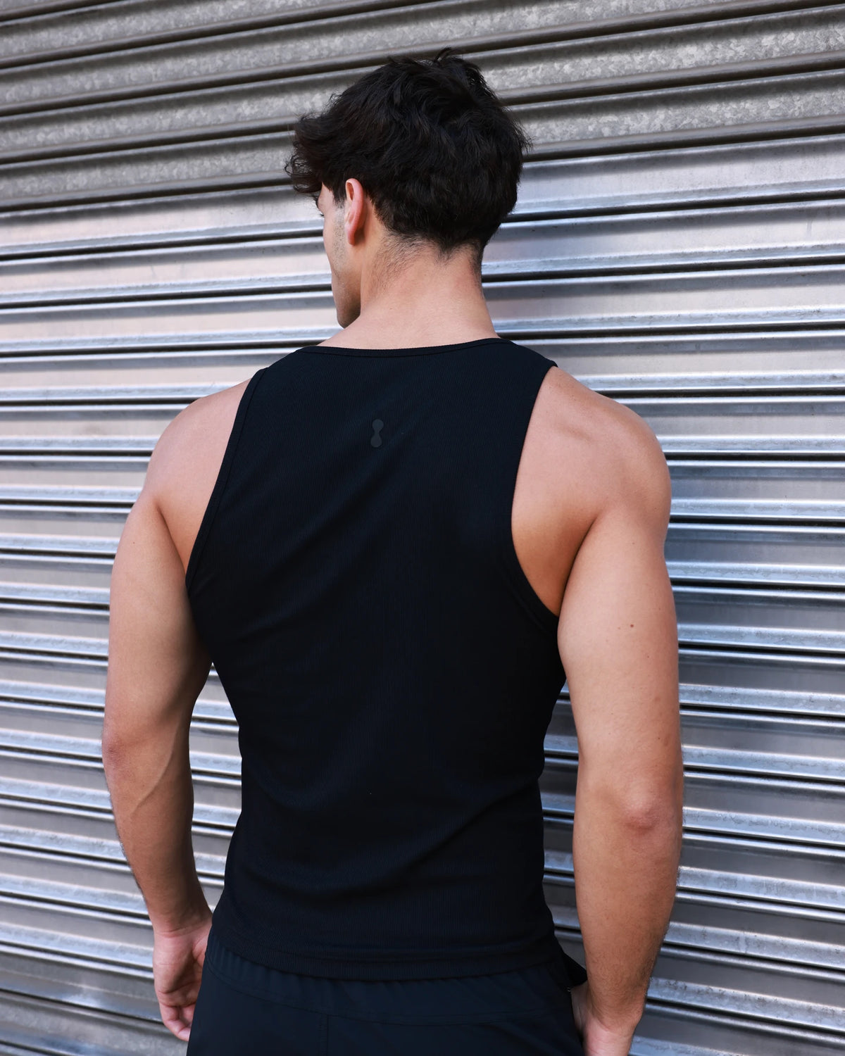 PODIO Volt 3-Pack Tanks — black ribbed muscle tank on model