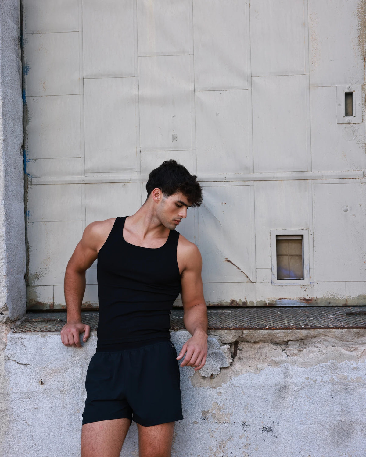 PODIO Volt 3-Pack Tanks — black ribbed muscle tank on model, full look