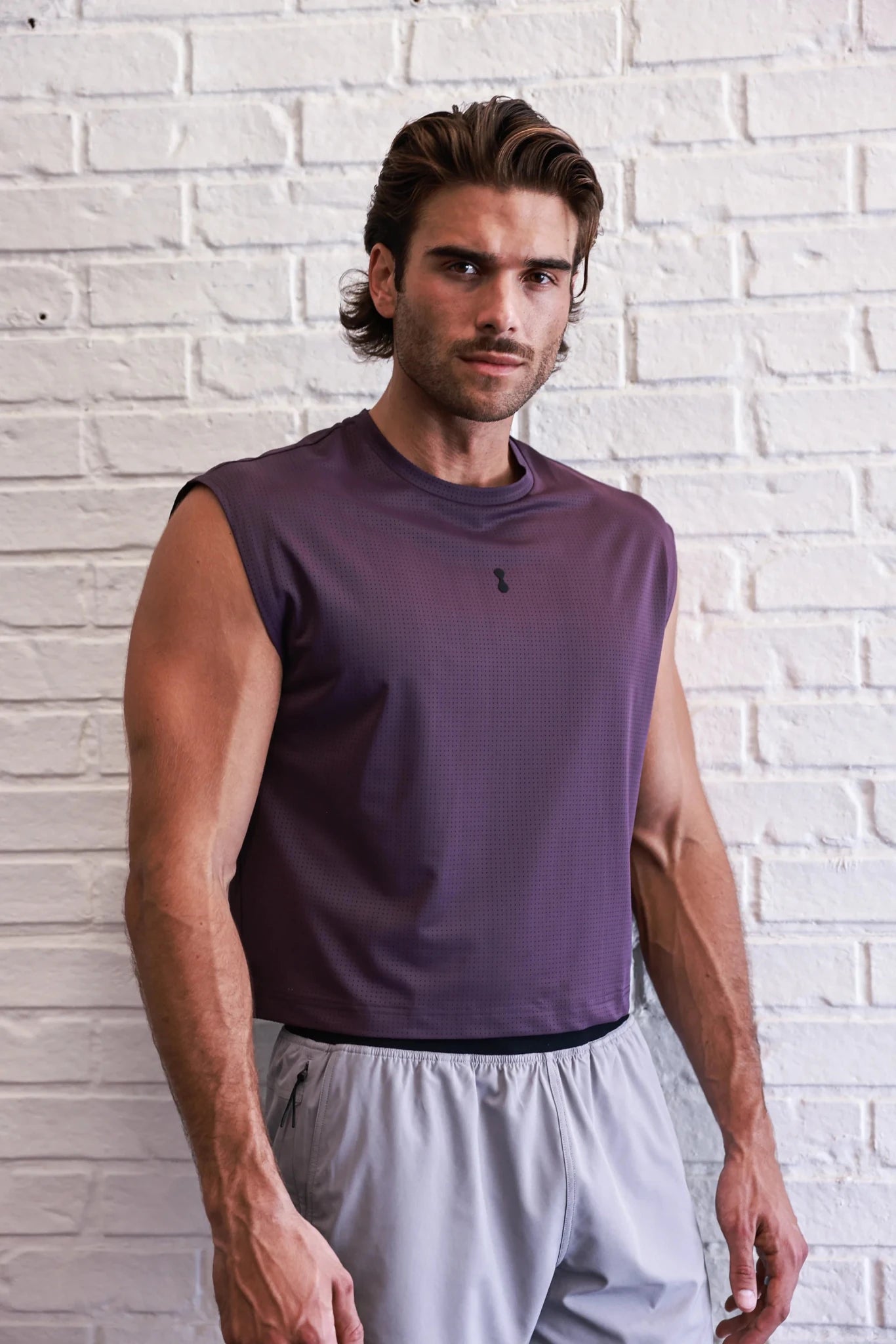 Podio Afterglow semi-cropped training tank top, lightweight athletic crop top with racerback design, in black fabric.