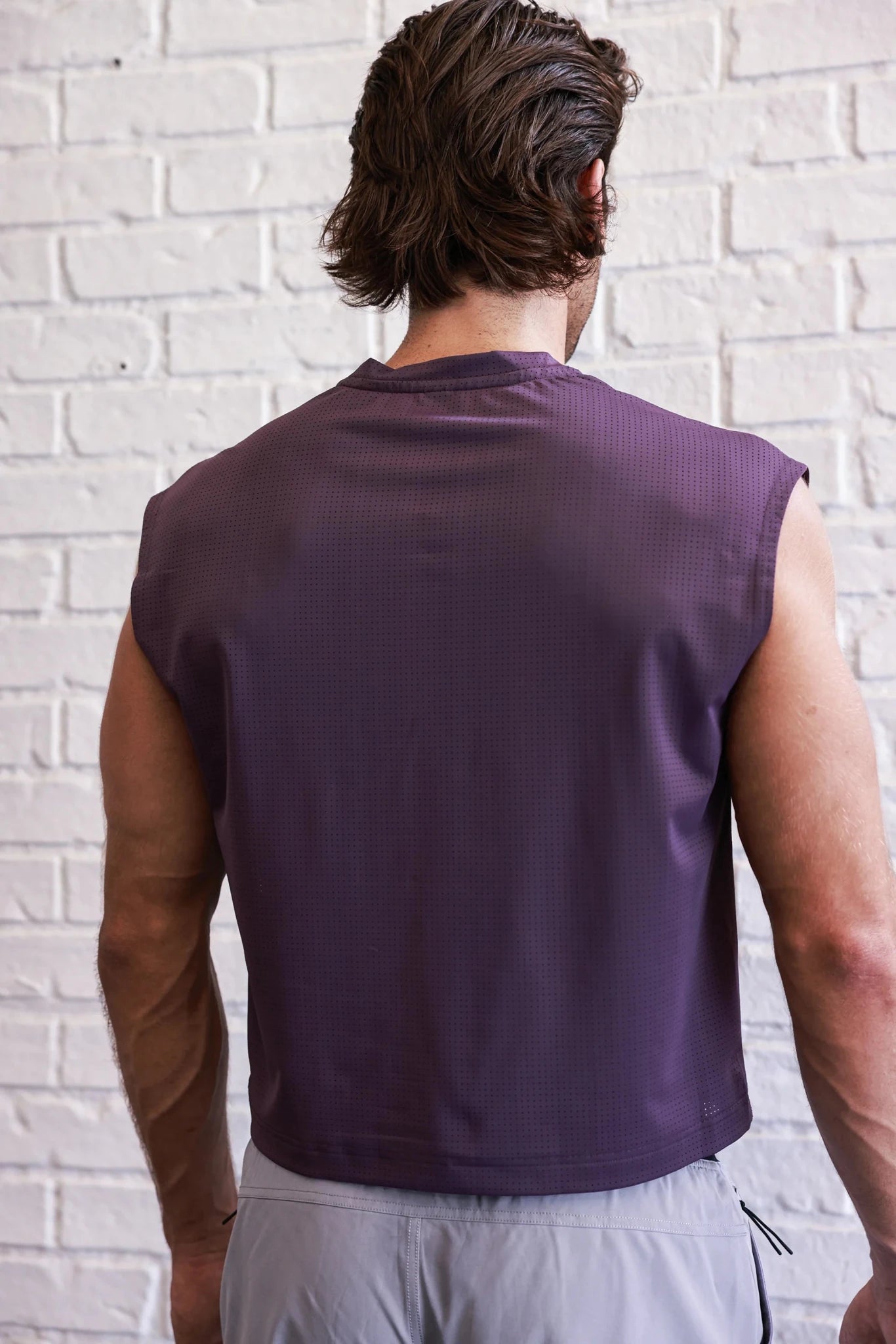 PODIO Afterglow Semi-Cropped Training Tank top in lightweight fabric, shown on a mannequin with a fitted, athletic style.