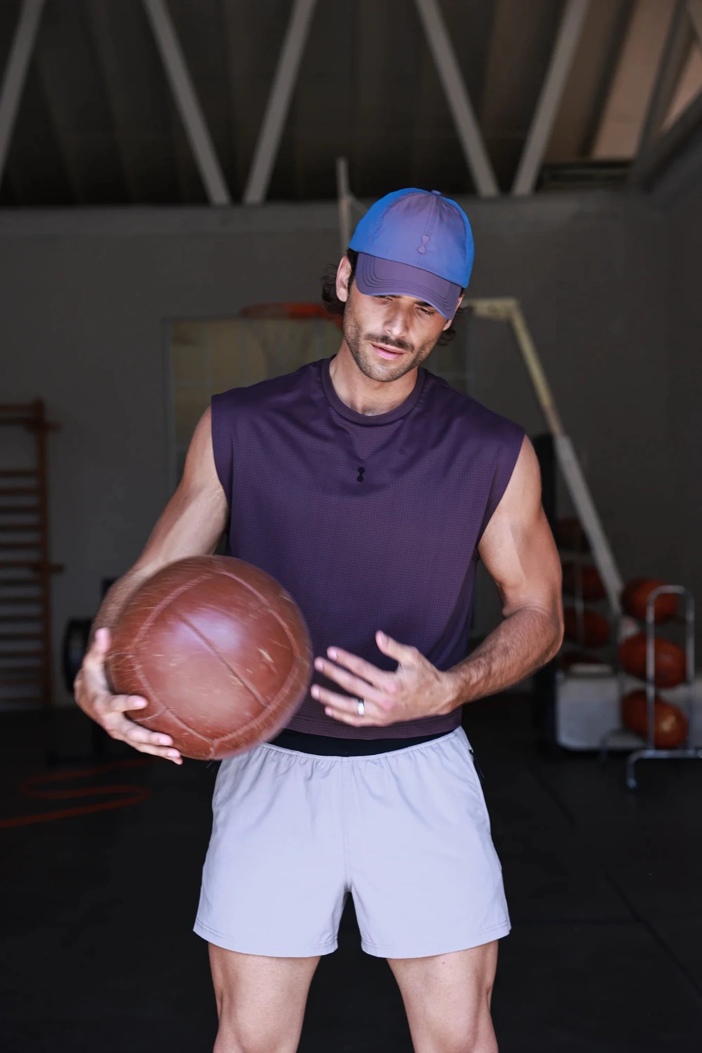PODIO Afterglow semi-cropped training tank top in black, featuring a fitted design and sleeveless style for workout comfort.