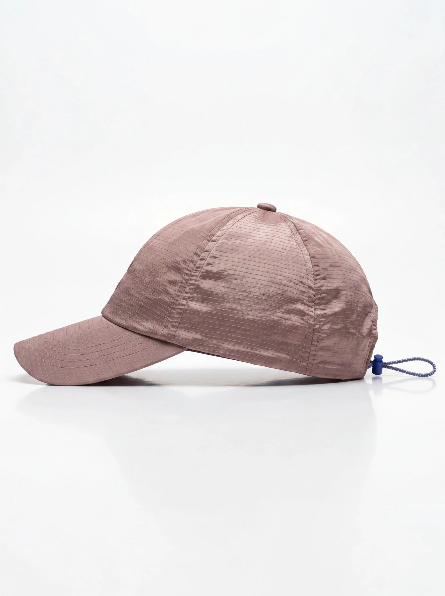PODIO Bone Metal Hat featuring a sleek bone-colored design with a structured metal construction and stylish brim.