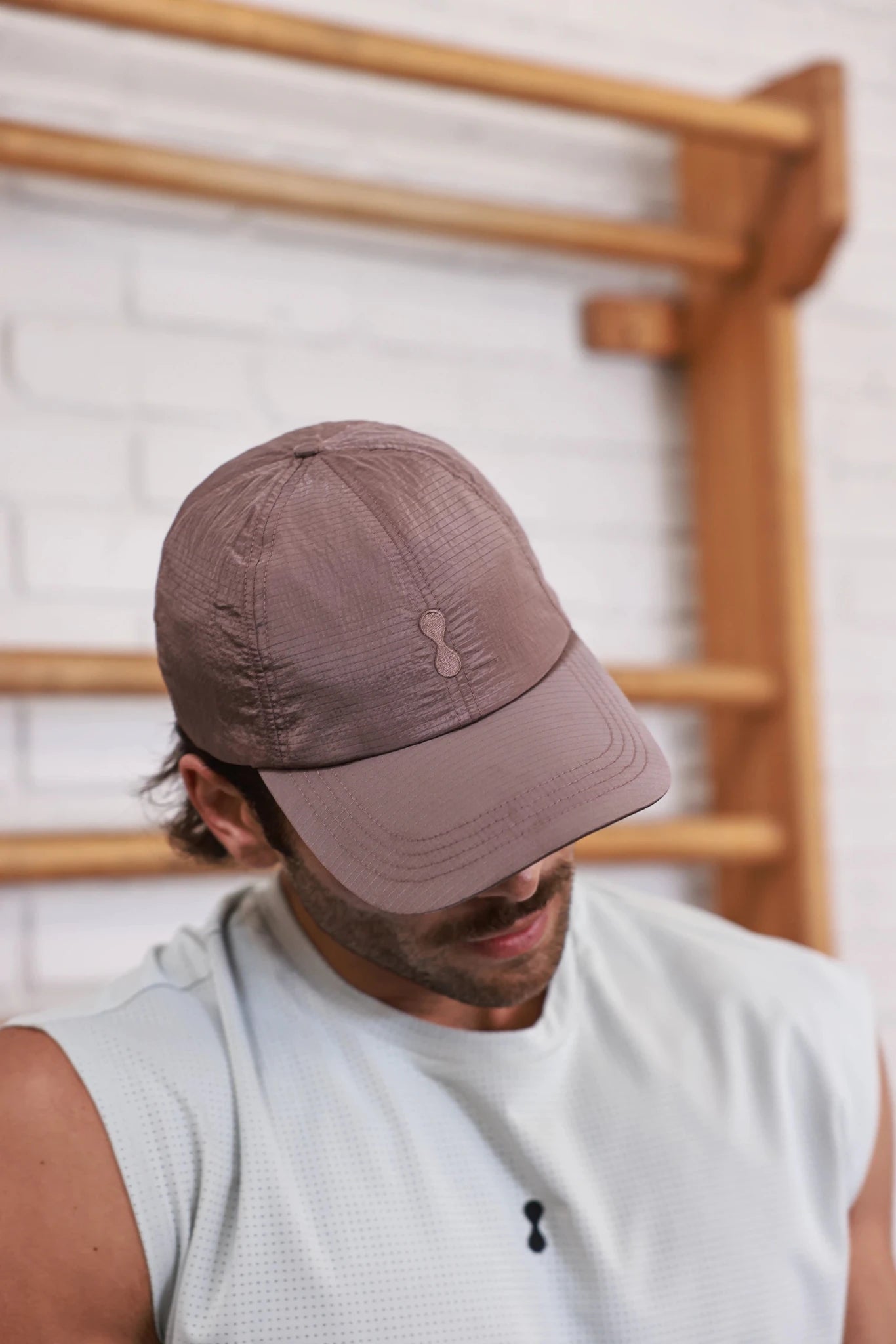 PODIO Bone Metal Hat featuring a sleek, metallic design with a bone-inspired structure, displayed on a neutral background.