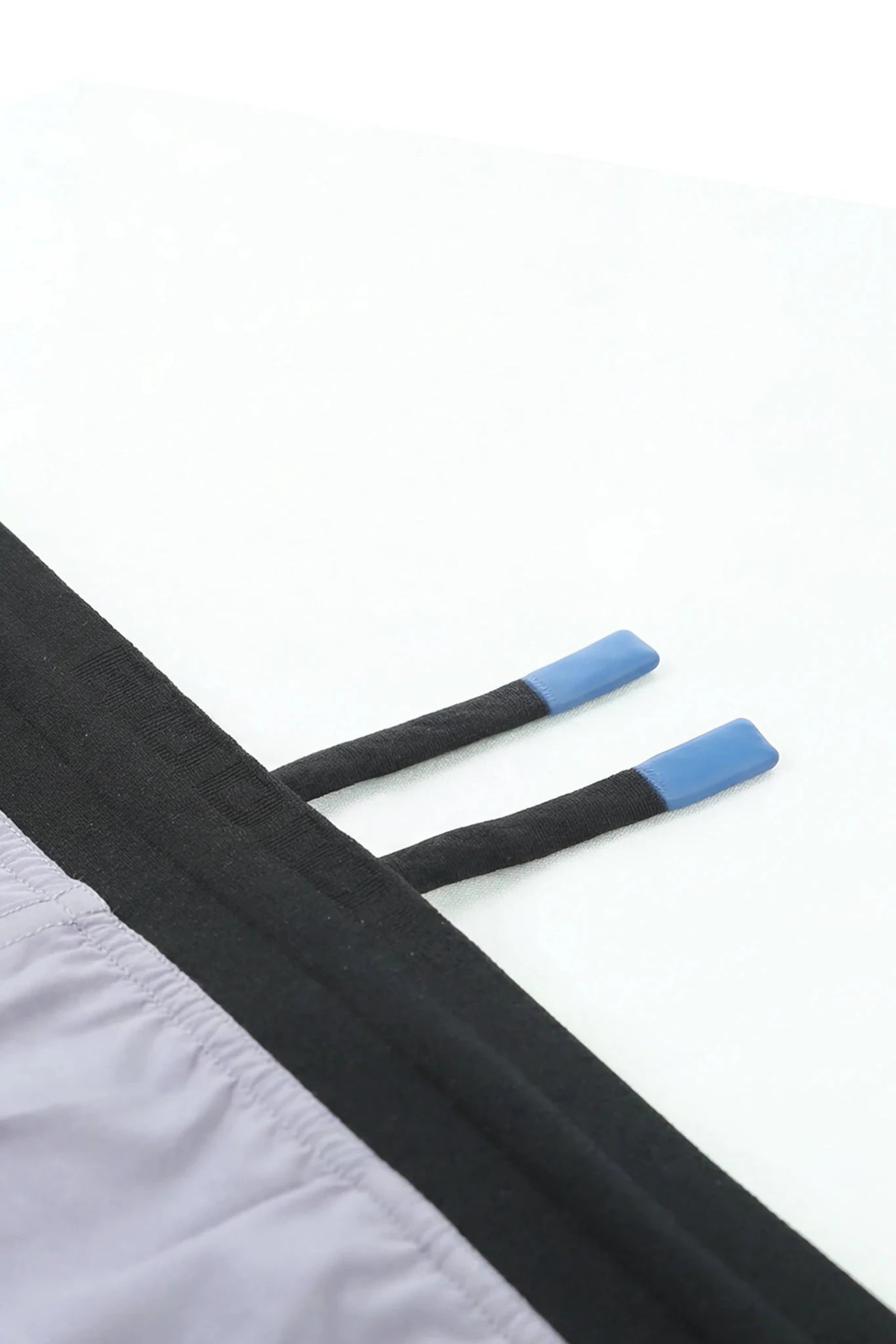 Podio Haze Active Short in gray with black accents, lightweight athletic shorts with an elastic waistband and side pockets.