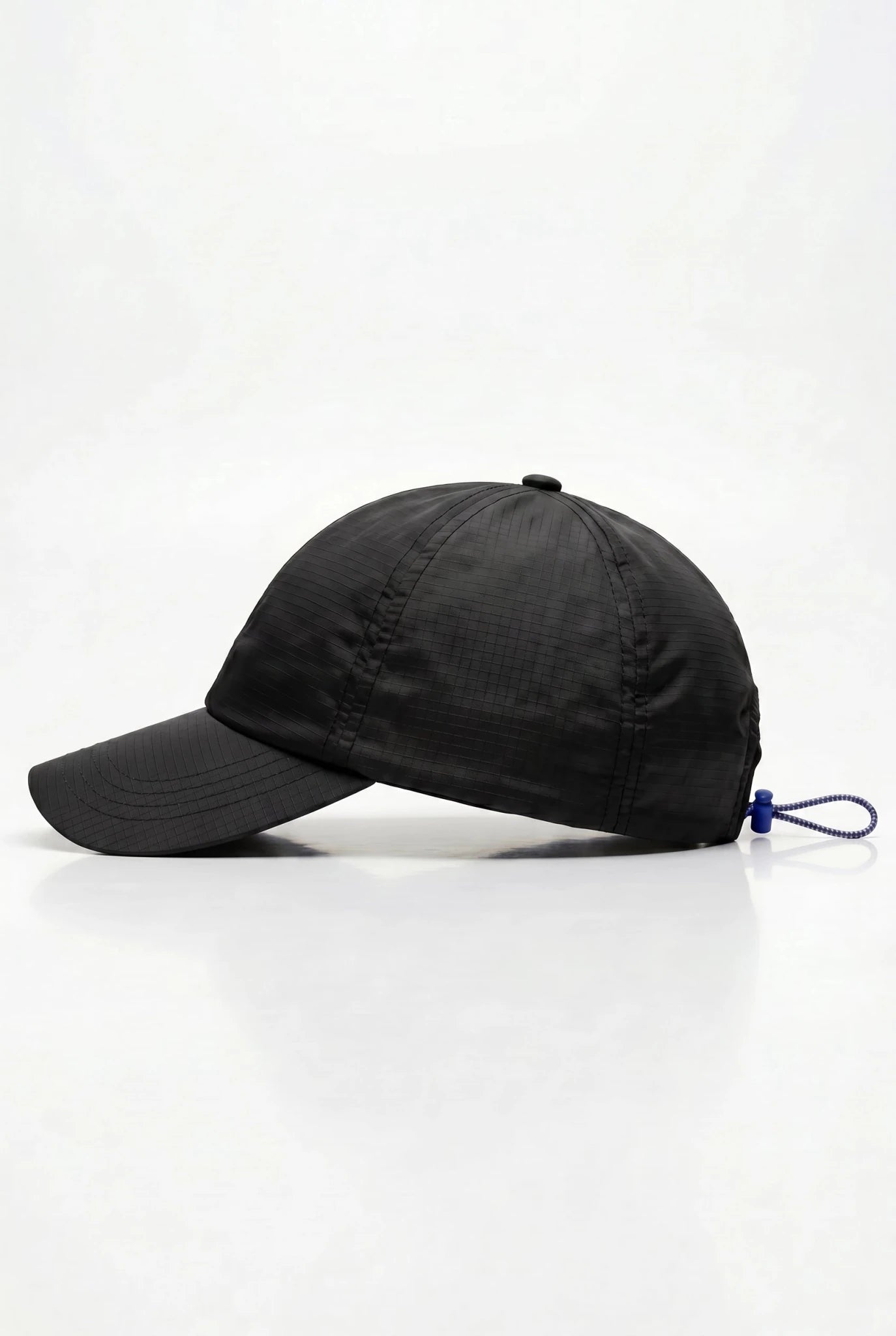 PODIO Midnight Metal Hat featuring a sleek, dark metallic finish and modern design, displayed on a neutral background.