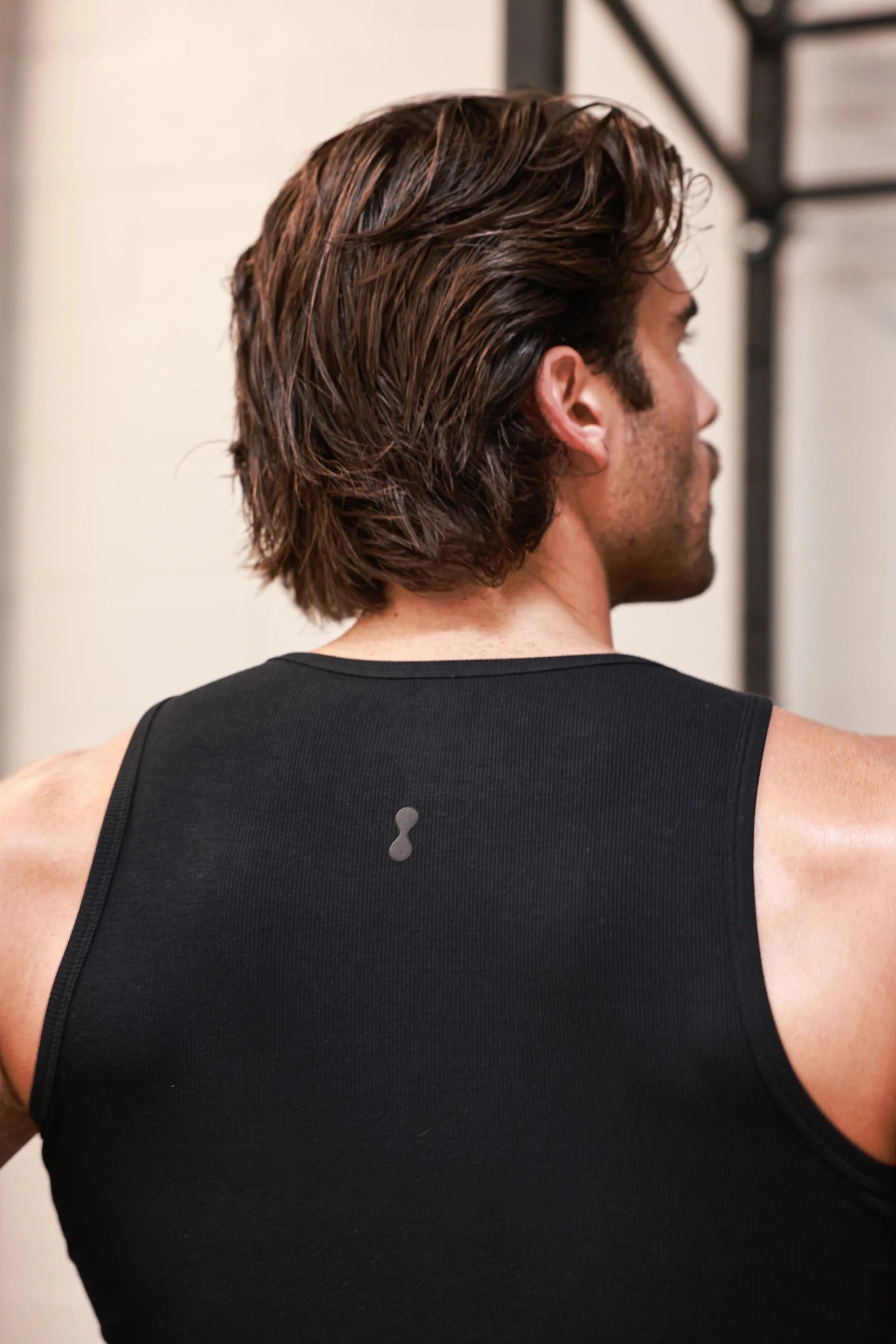 Black PODIO Midnight Muscle Tank top with sleeveless design and athletic fit, perfect for workout or casual wear.