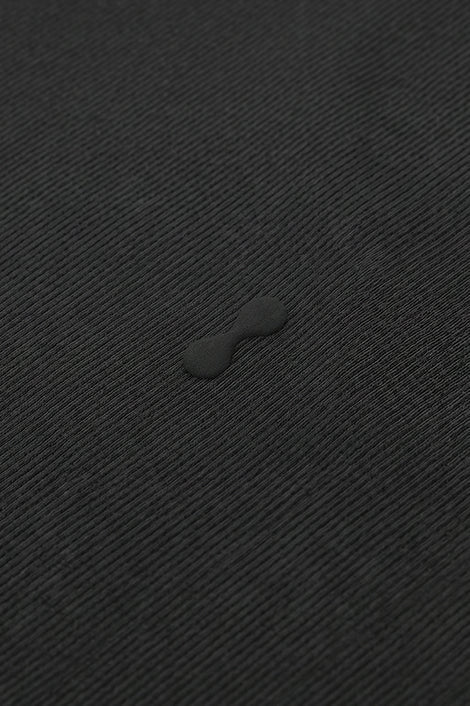 Midnight PODIO muscle tank top with sleeveless design and athletic fit, showcasing casual style and comfortable fabric.