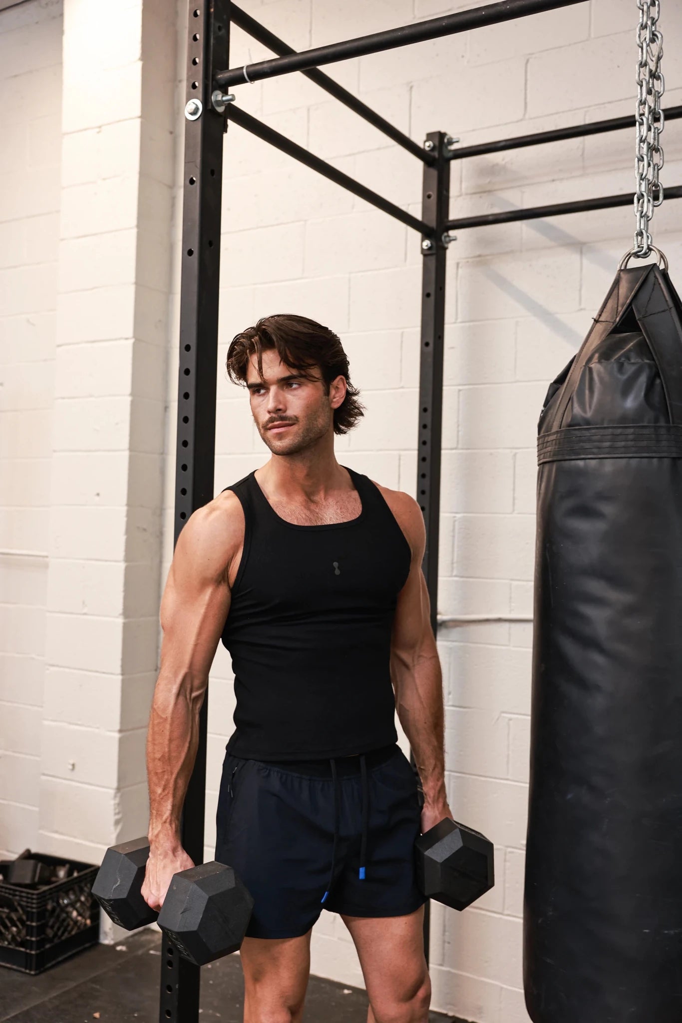Black PODIO Midnight Muscle Tank top with sleeveless design and athletic fit, ideal for workout or casual wear.
