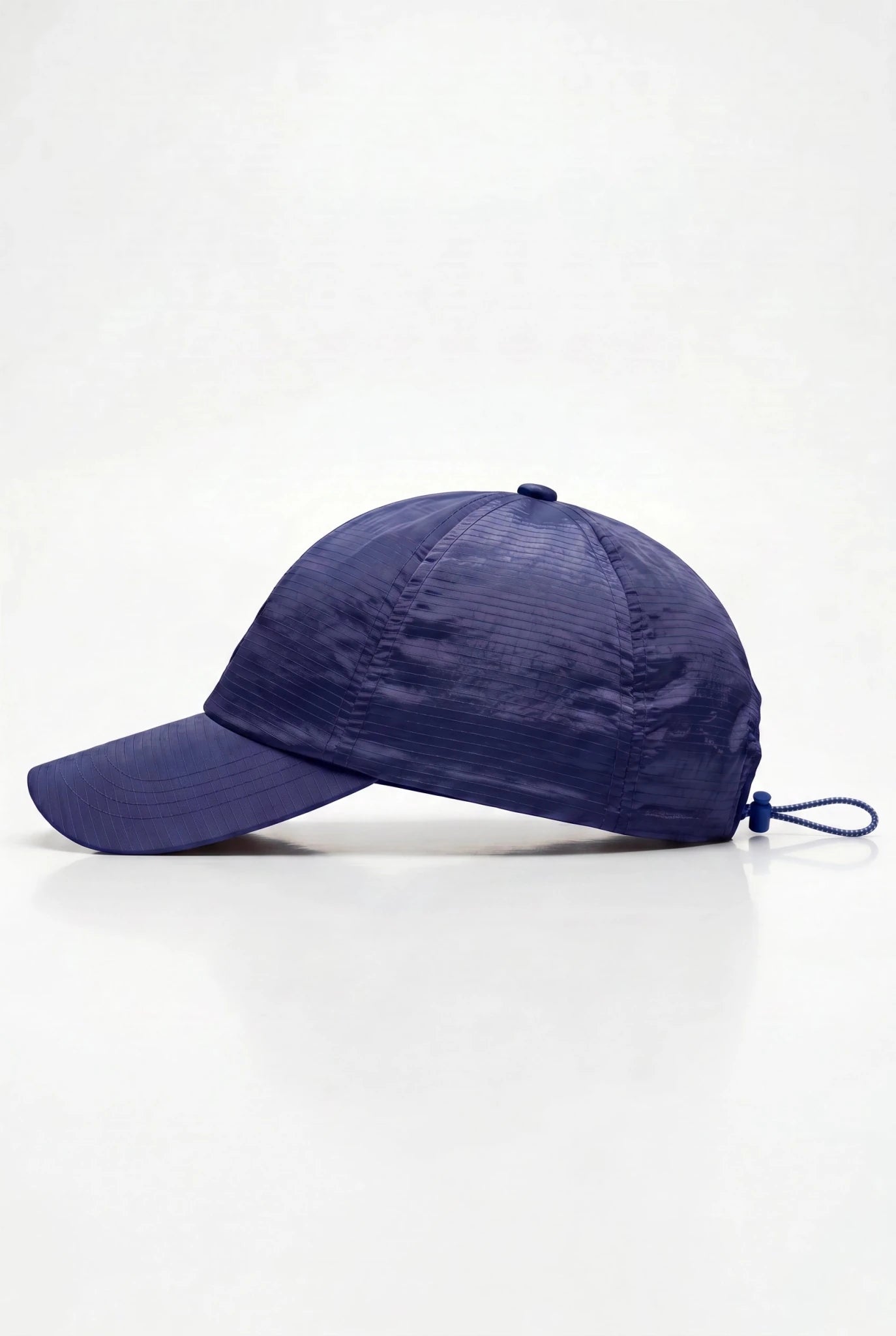 PODIO Voltage Metal Hat featuring a sleek metallic design with a vibrant color change on the sides, stylish headwear accessory.